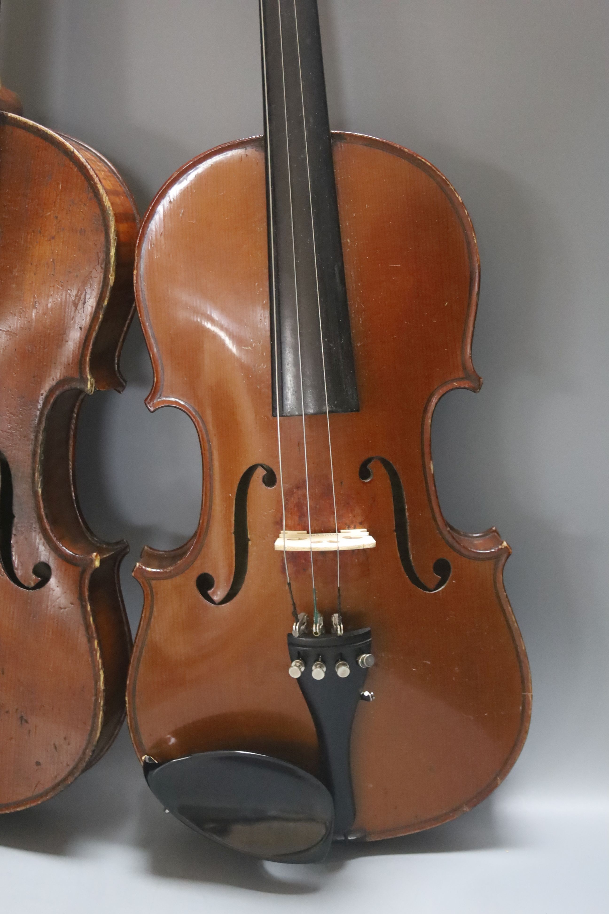 An early 20th century French vioilin, cased with bow and a cased saxon violin